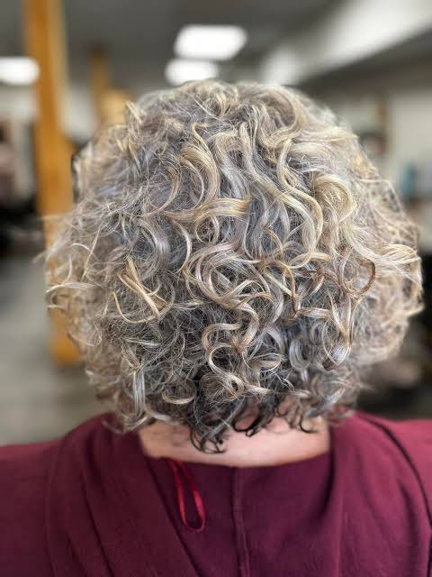 Short Curly Bob With Gray-Blonde Blend Short Curly Bob With Gray-Blonde Blend — Gray Blending Highlights