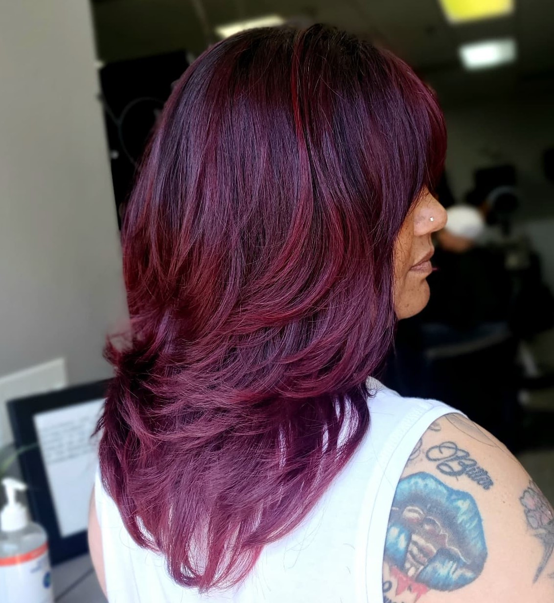 Layered Lob With Side-Swept Bangs Layered Lob With Side-Swept Bangs — Burgundy Hair Color