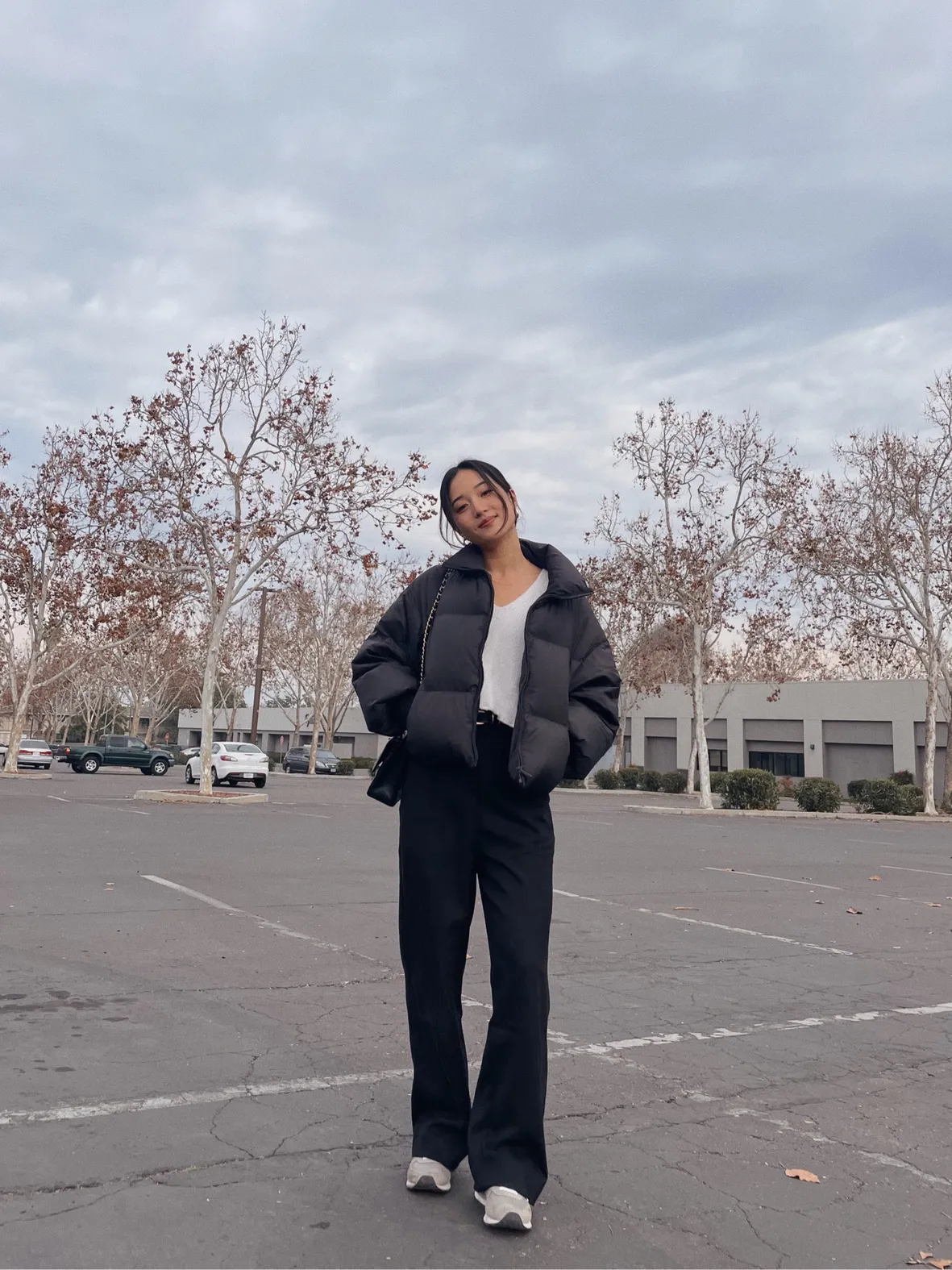 Black Puffer Jacket with White T-Shirt and Wide-Leg Pants — Korean Winter Outfits