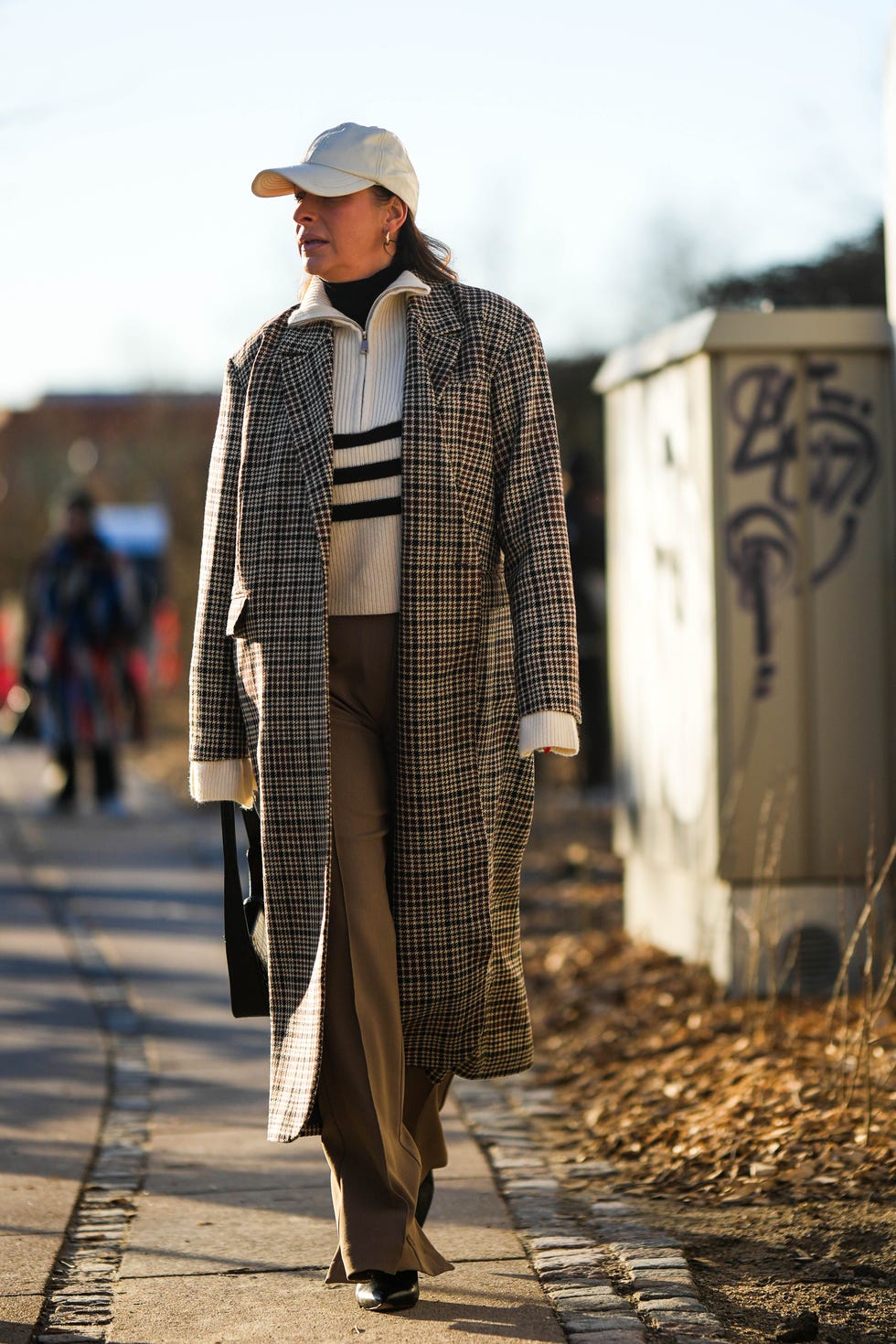 Plaid Coat Over Striped Sweater and Trousers — Europe Winter Outfits