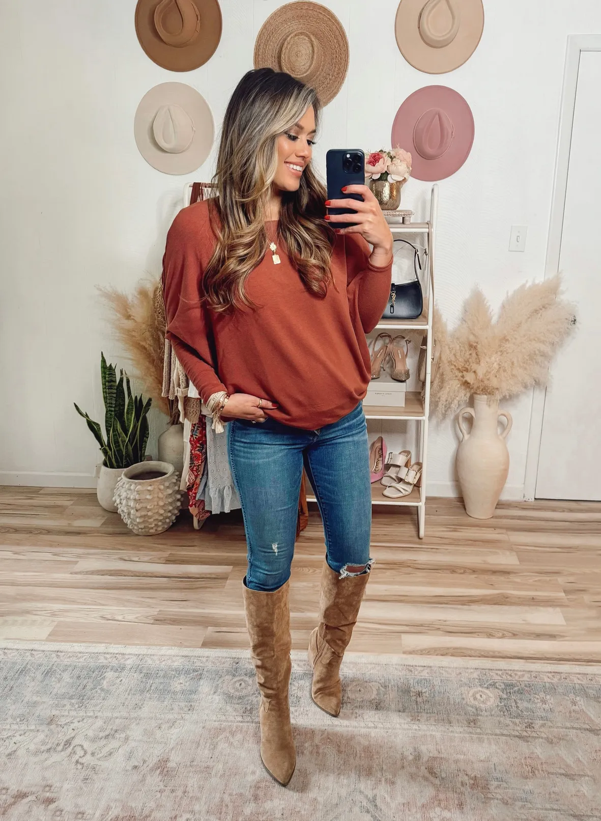 Relaxed Denim: Brown Knee-High Boots with Knit Top and Ripped Jeans — Brown Boots Outfits