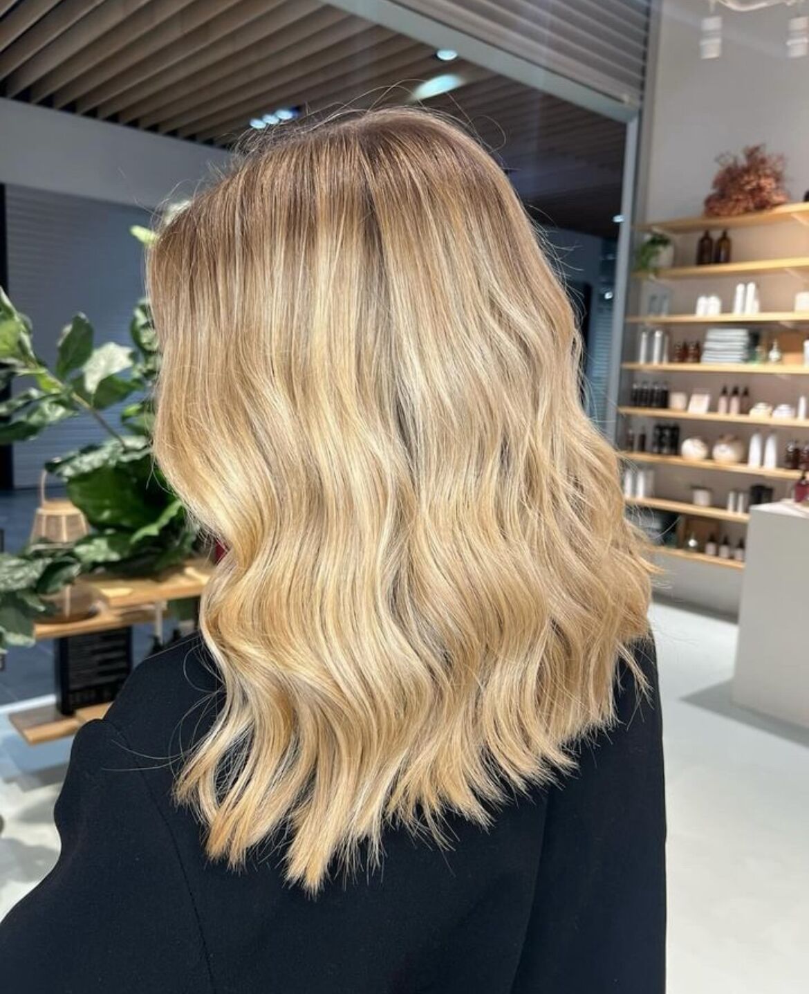 Ash Blonde Wavy Hair with a Black Top — Blonde Hair Colour