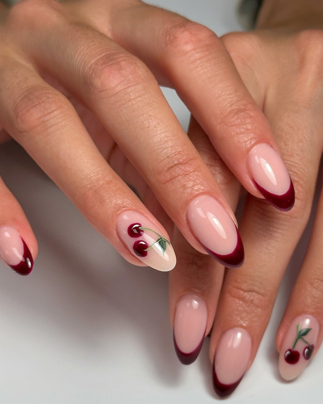 Sheer Nude with Cherry Art and Red French Tips Sheer Nude with Cherry Art and Red French Tips — Cherry Red Nails