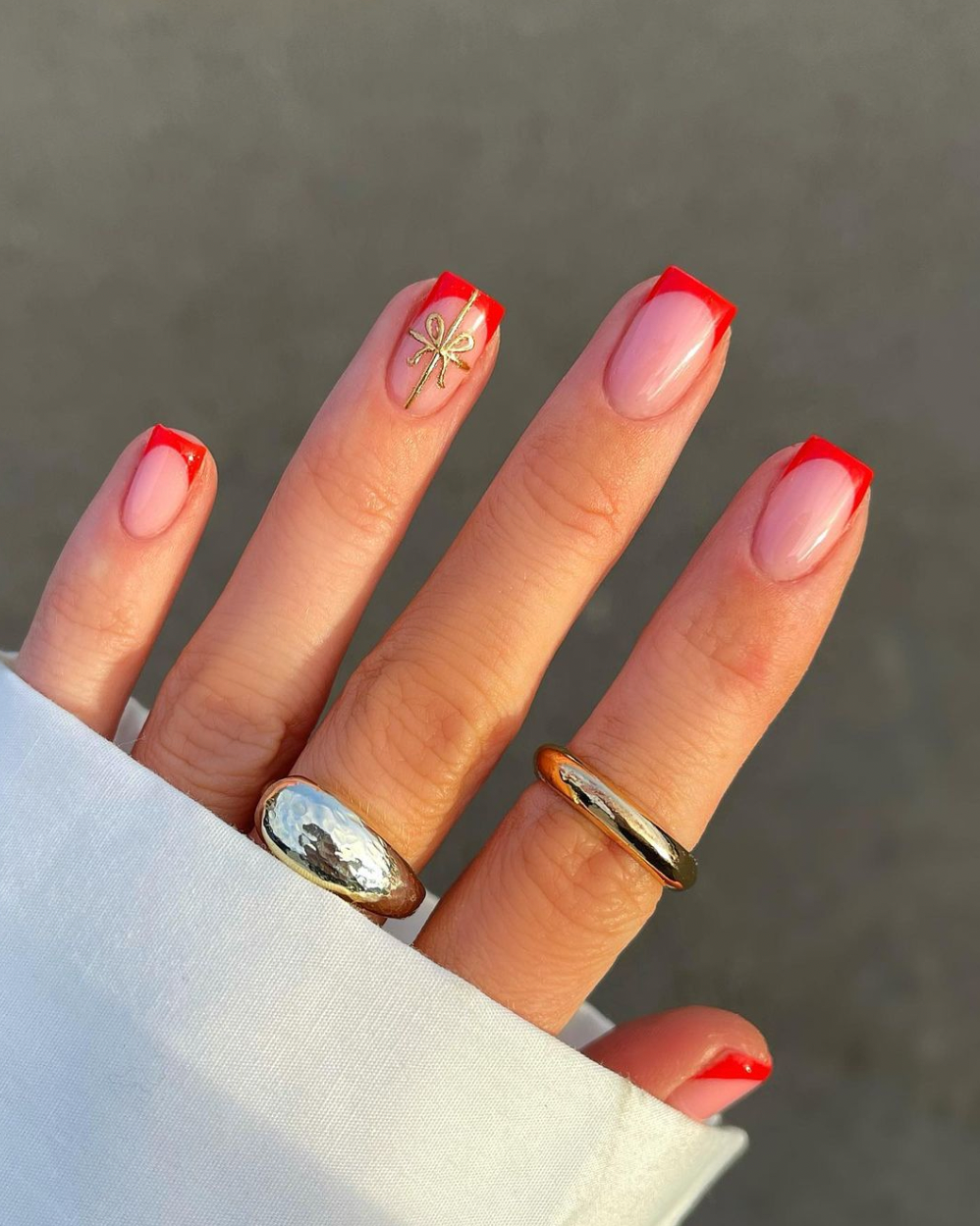Festive Red French Tips with Gold Bow Festive Red French Tips with Gold Bow — Winter Nail Colors for Women Over 40