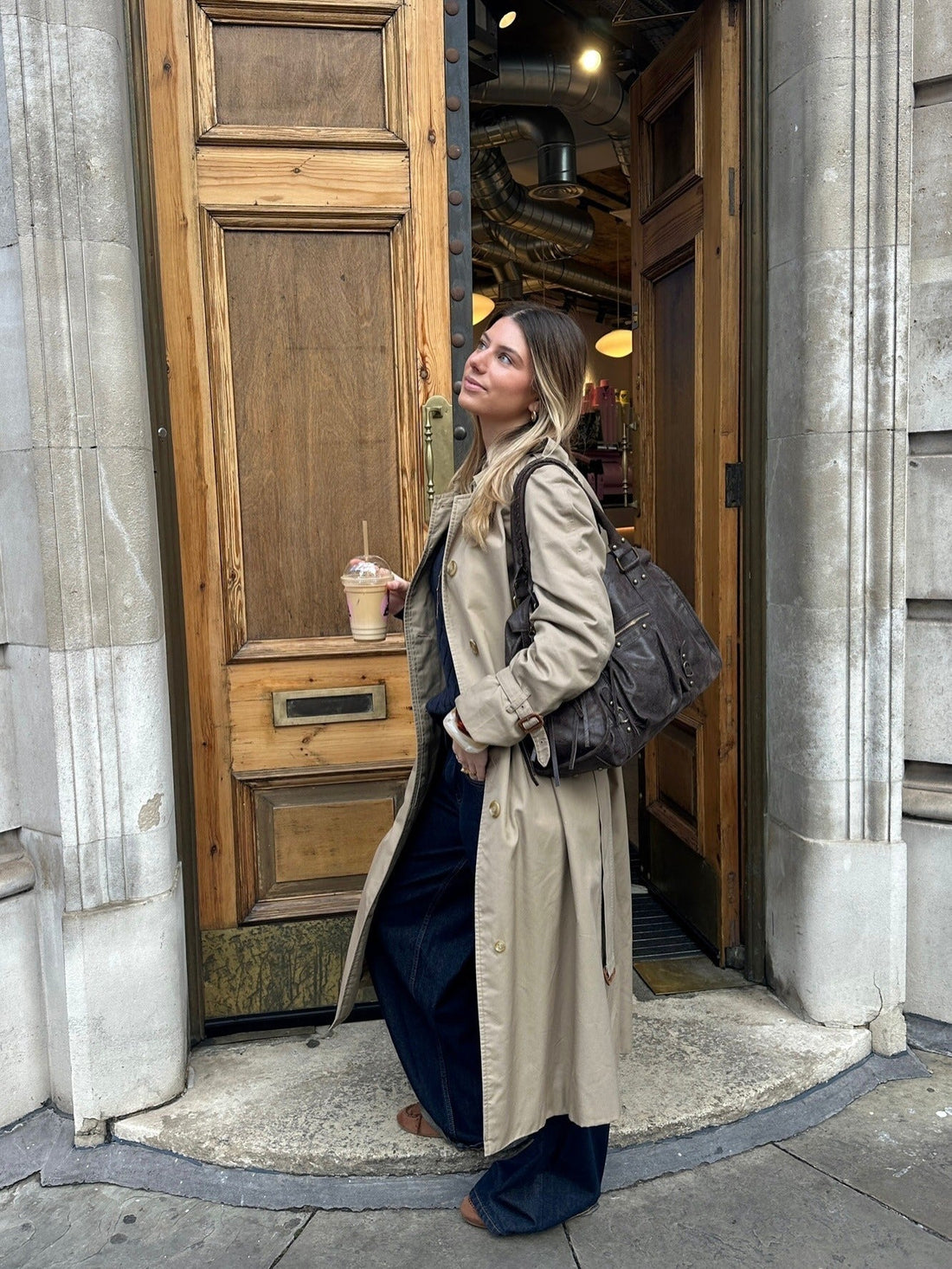 Beige Trench Coat with Dark Blue Top and Wide-Leg Jeans — Long Coat Outfits
