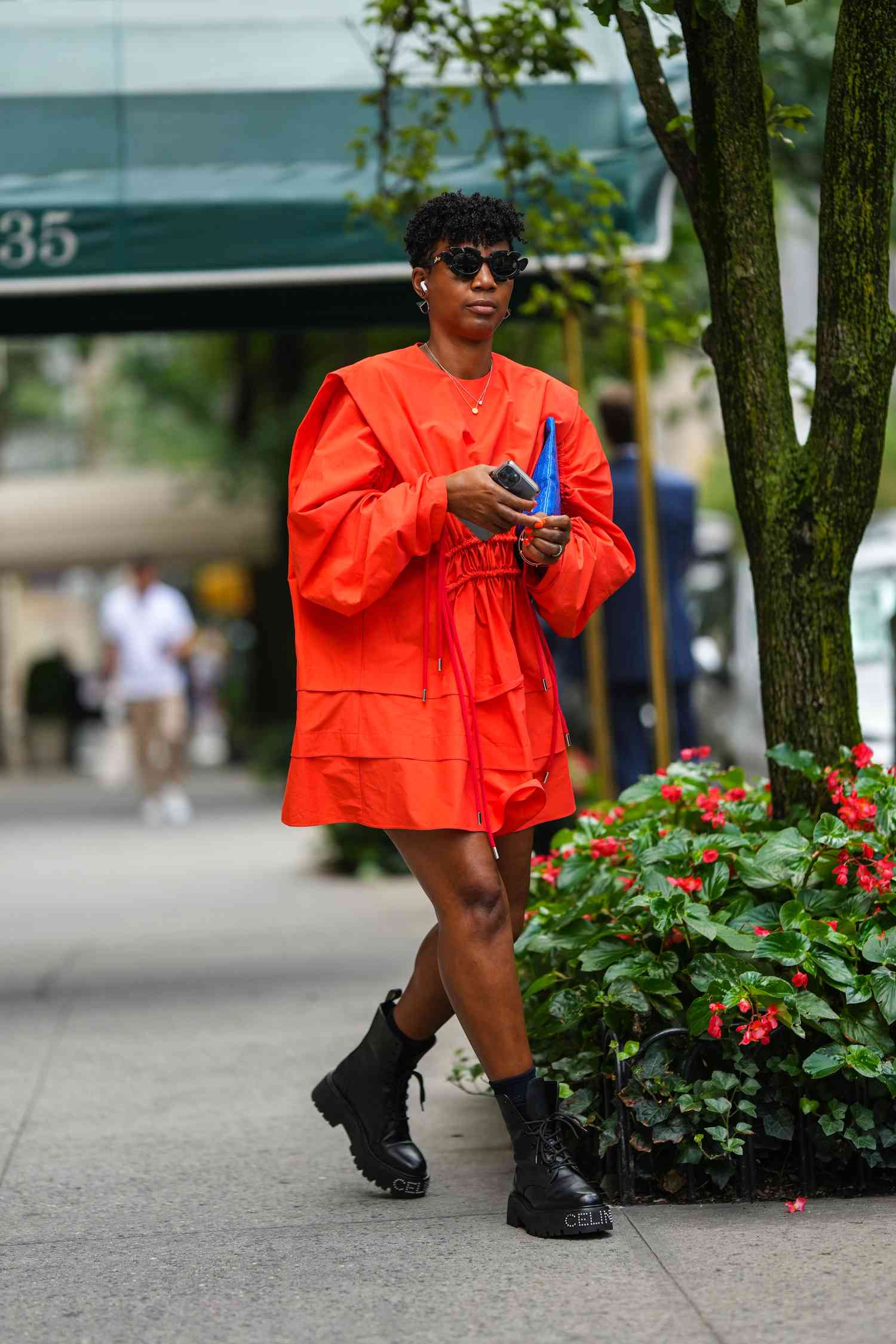 Street Style Black Combat Boots With a Vibrant Orange Mini Dress — Combat Boots Outfits