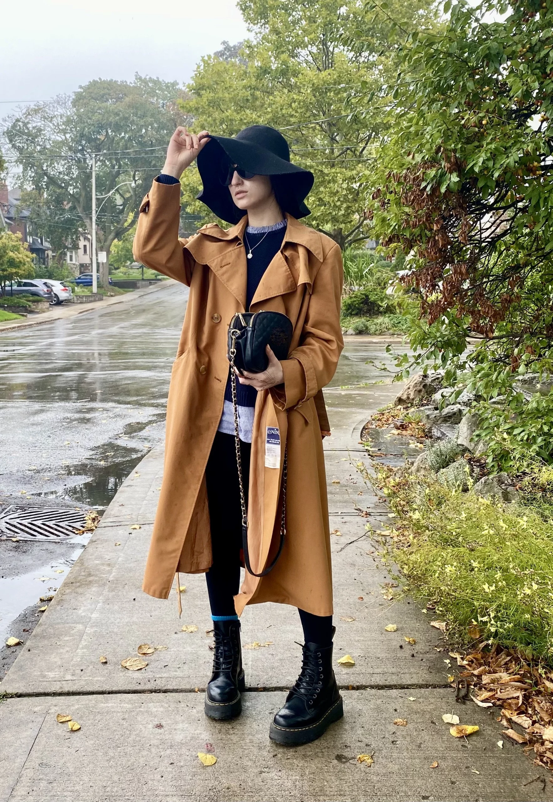 Platform Combat Boots With a Tan Trench Coat and Striped Sweater — Combat Boots Outfits