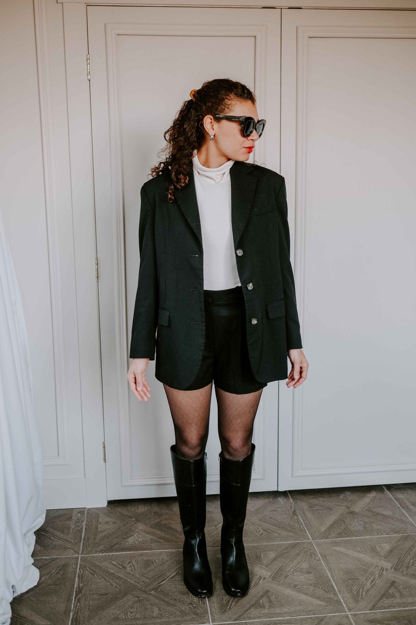 Black Knee-High Boots with Blazer, Shorts, and Fishnet Tights — Winter Boots Outfits
