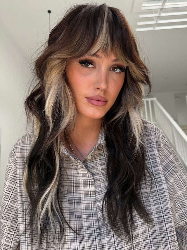 Long Dark Hair with Bold Blonde Highlights and Bangs Long Dark Hair with Bold Blonde Highlights and Bangs — Trendy Haircuts for Women