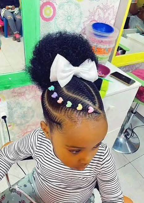 Braided Updo With Heart Beads and Bow — Winter Hairstyles for Black Kids