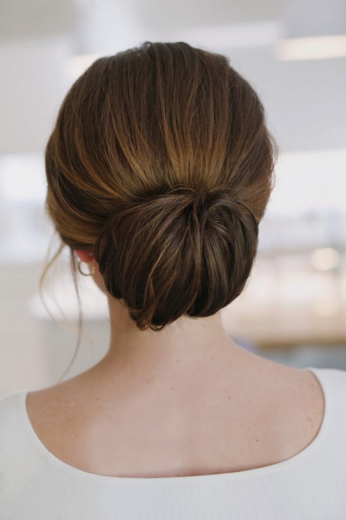 Blonde Half-Up Half-Down With Floral Accessory — Winter Wedding Guest Hairstyles