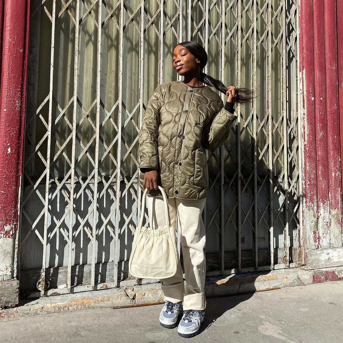 Quilted Olive Jacket Over Black Top and Cream Trousers Quilted Olive Jacket Over Black Top and Cream Trousers — Winter Streetwear Outfits