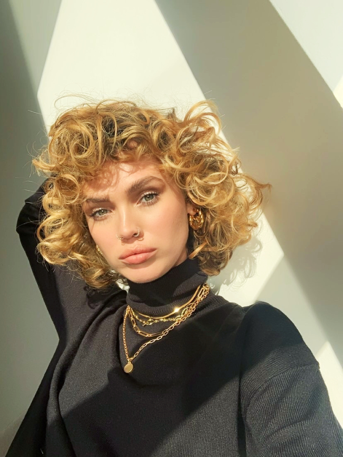 Honey Blonde Bob With Textured Curtain Bangs Honey Blonde Bob With Textured Curtain Bangs — Winter Haircuts for Curly Hair