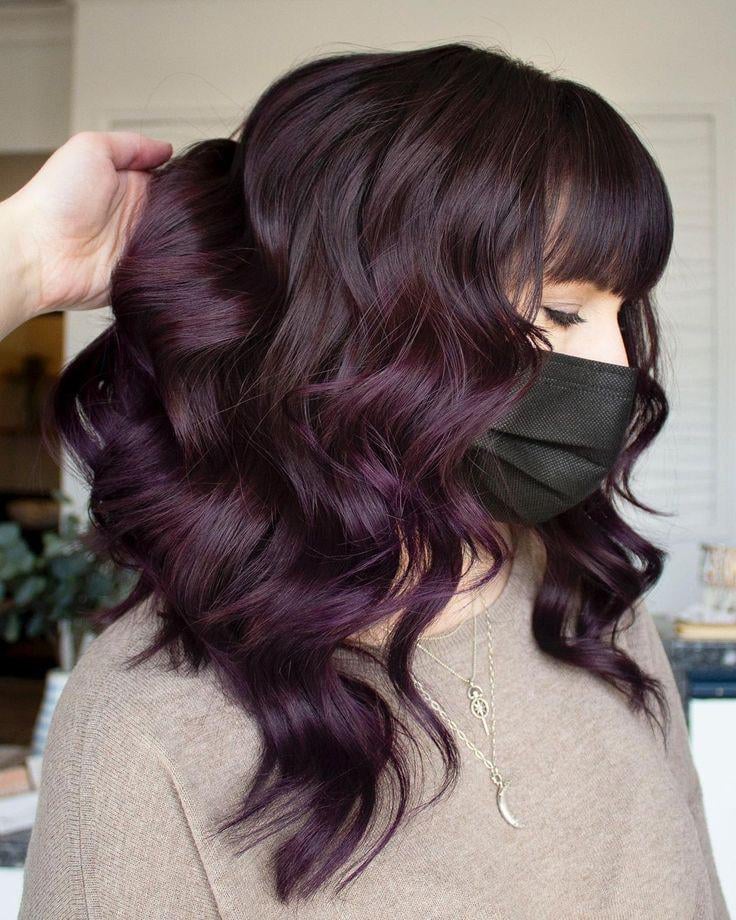 Deep Plum Angled Bob With Blunt Bangs Deep Plum Angled Bob With Blunt Bangs — Cool Winter Hair Colors