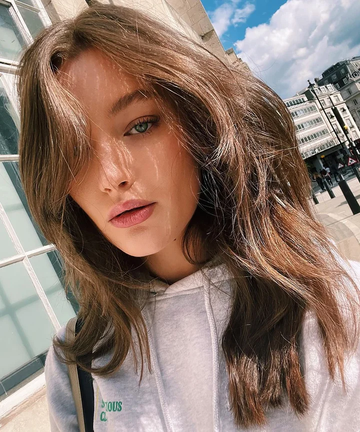 Medium Brown With Subtle Highlights Collarbone Medium Brown Layers With Air-Dried Bangs Medium Brown With Subtle Highlights Collarbone Medium Brown Layers With Air-Dried Bangs — Winter Haircuts with Curtain Bangs