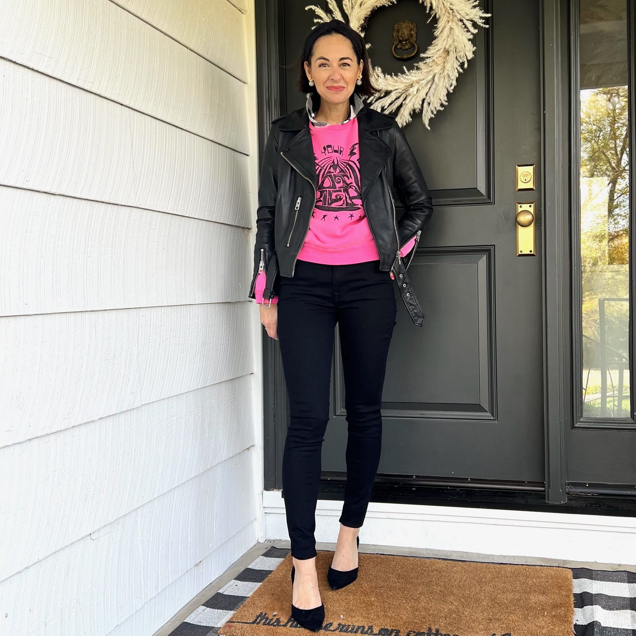 Edgy Leather Jacket with Bright Pink Sweatshirt — Winter Outfits for Women Over 40