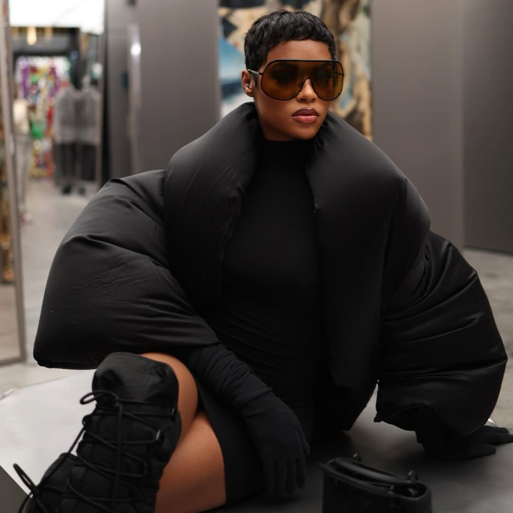 Oversized Black Puffer Jacket Over Fitted Black Dress — Winter Outfits for Black Girls