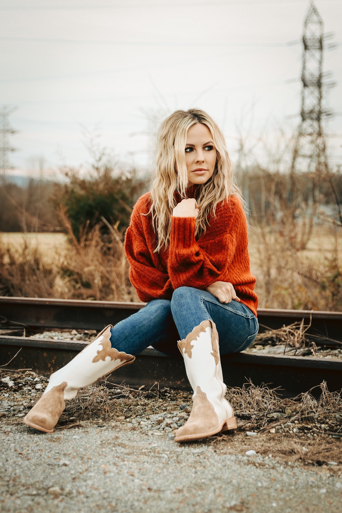 Statement Boots: White and Tan Cowboy Boots with Orange Sweater — Brown Boots Outfits