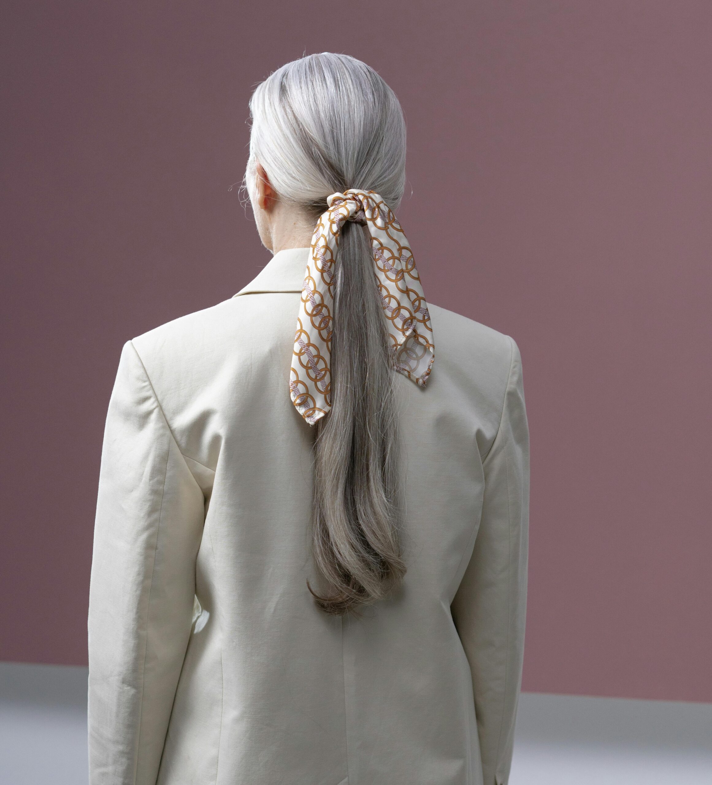 Low Ponytail with Silk Scarf Accent Low Ponytail with Silk Scarf Accent — Winter Hairstyles with Scarf