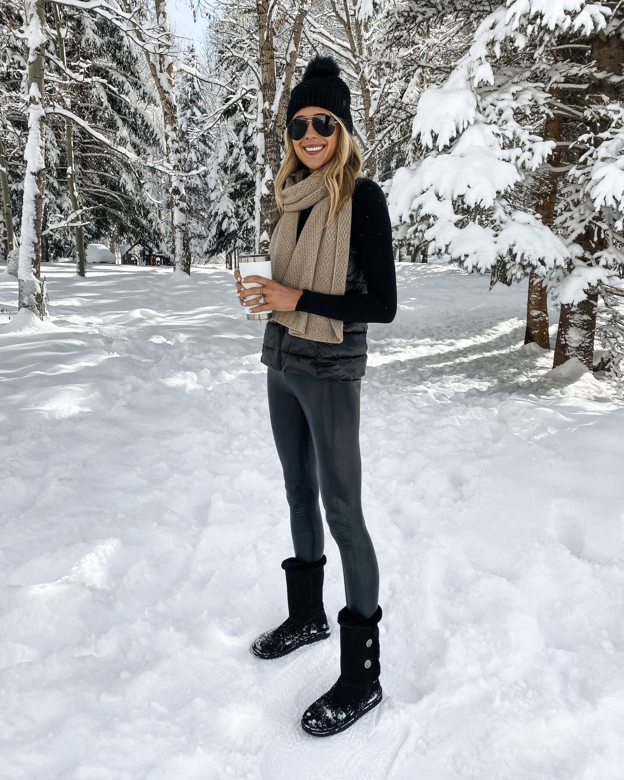 All-Black Outfit with Fur-Lined Boots for a Chic Snow Day — Snow Day Outfits