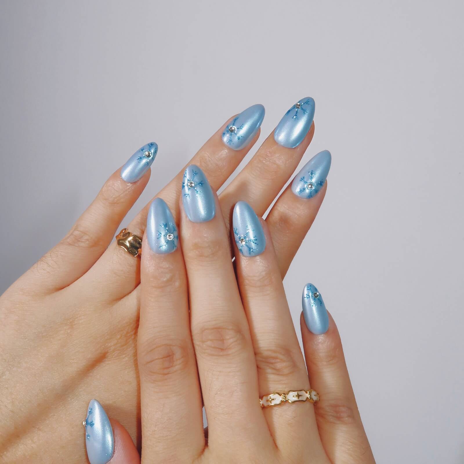 Metallic Blue with Snowflake and Rhinestone Accents — Winter Blue Nails