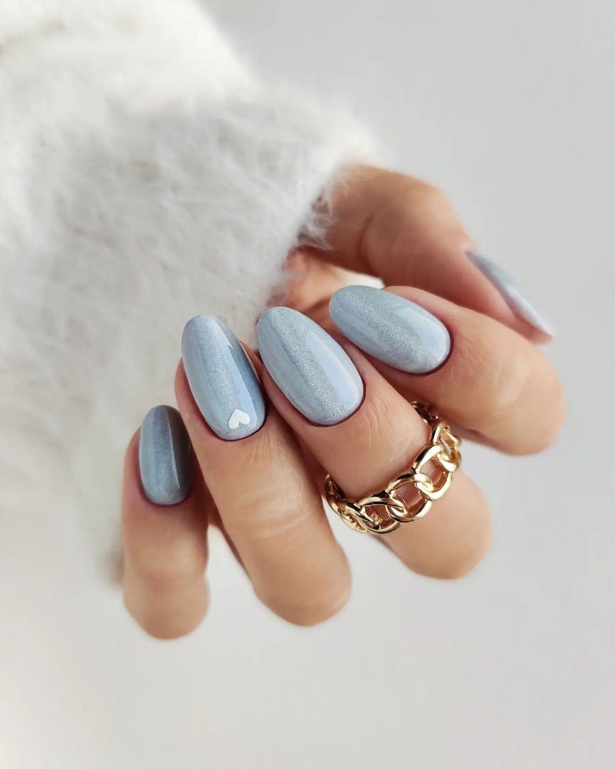 Light Blue Shimmer Heart Oval Nails Light Blue Shimmer Heart Oval Nails — Medium Length Winter Nails