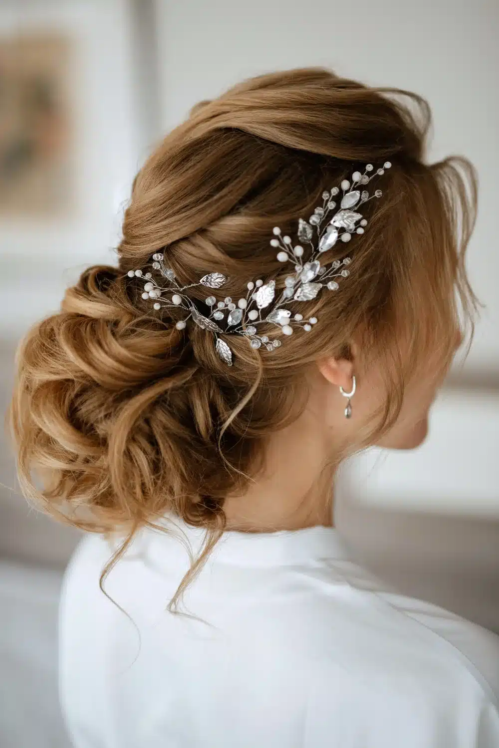 Light Brown Twisted Updo With Accessory — Winter Wedding Guest Hairstyles