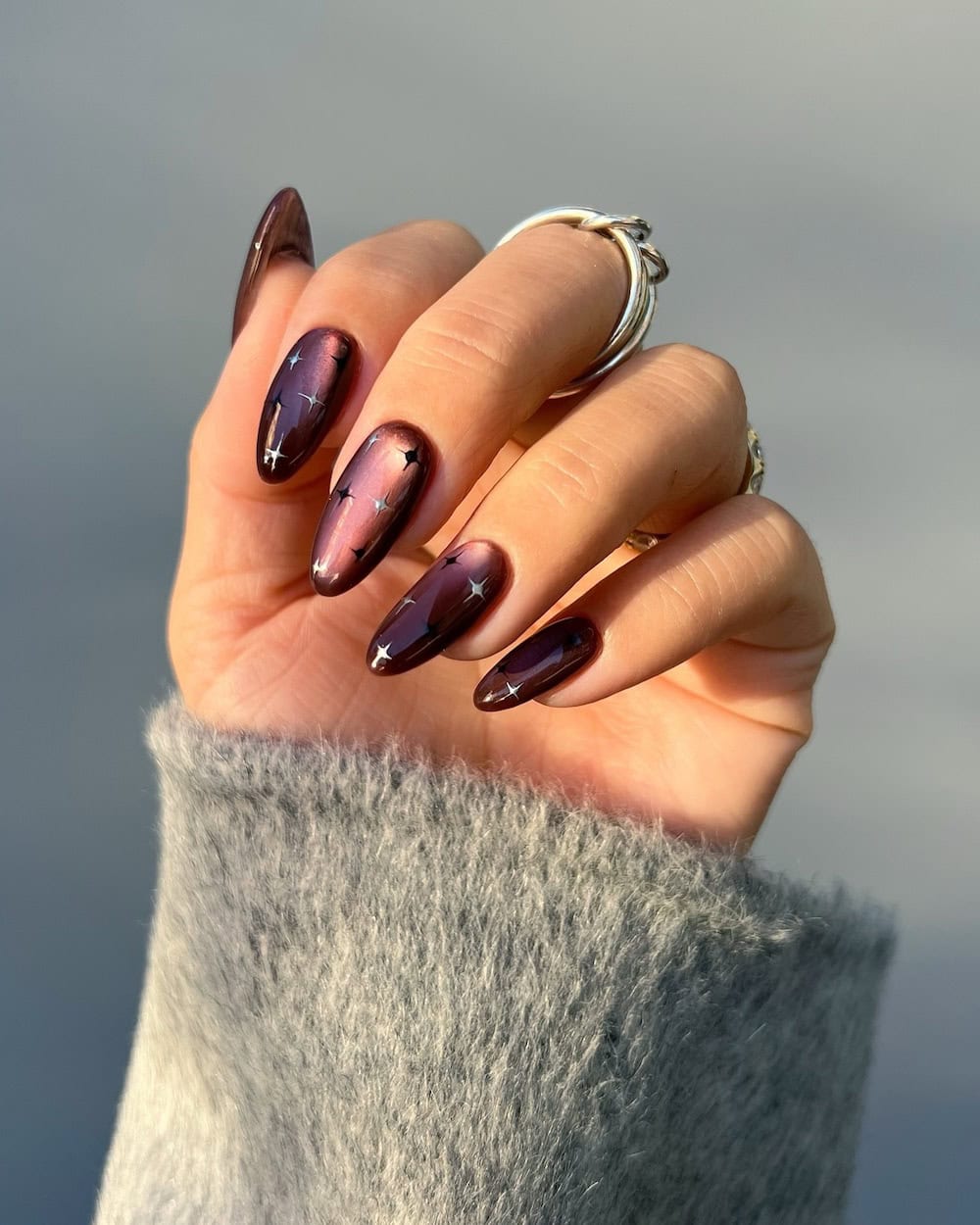 Deep Purple Magnetic Polish with Silver Stars Deep Purple Magnetic Polish with Silver Stars — Winter Nail Colors for Dark Skin