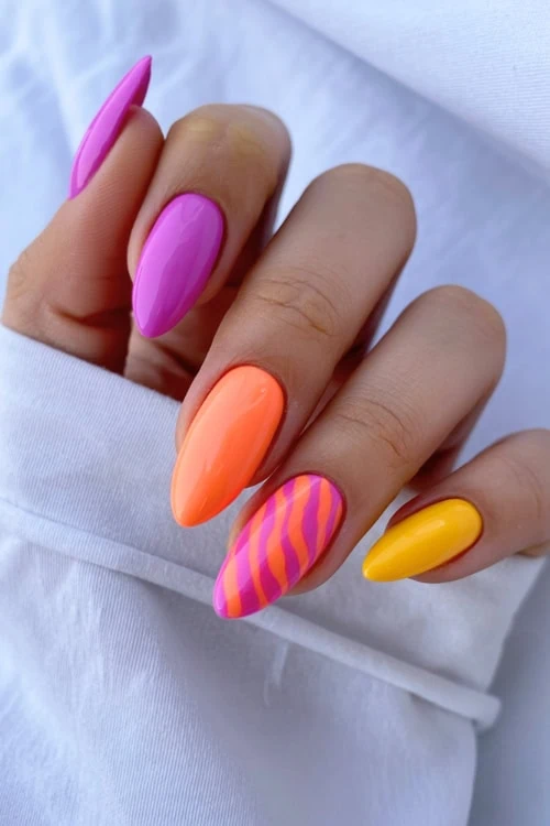 Vibrant Wavy Stripe Almonds Vibrant Wavy Stripe Almonds — Trendy Almond Nail Designs