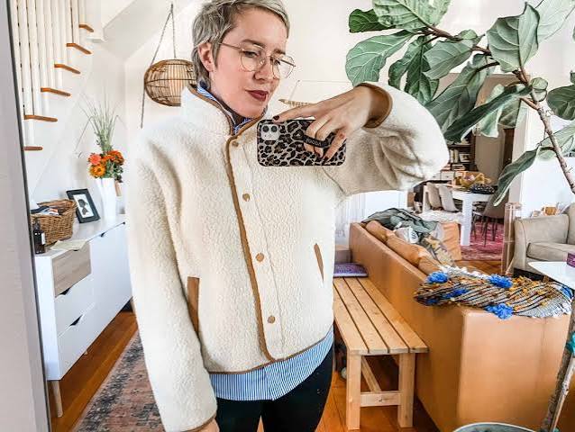 Classic Pairing: Cream Fleece Jacket with Stripes and Black Pants Classic Pairing: Cream Fleece Jacket with Stripes and Black Pants — Fleece Jacket Outfits