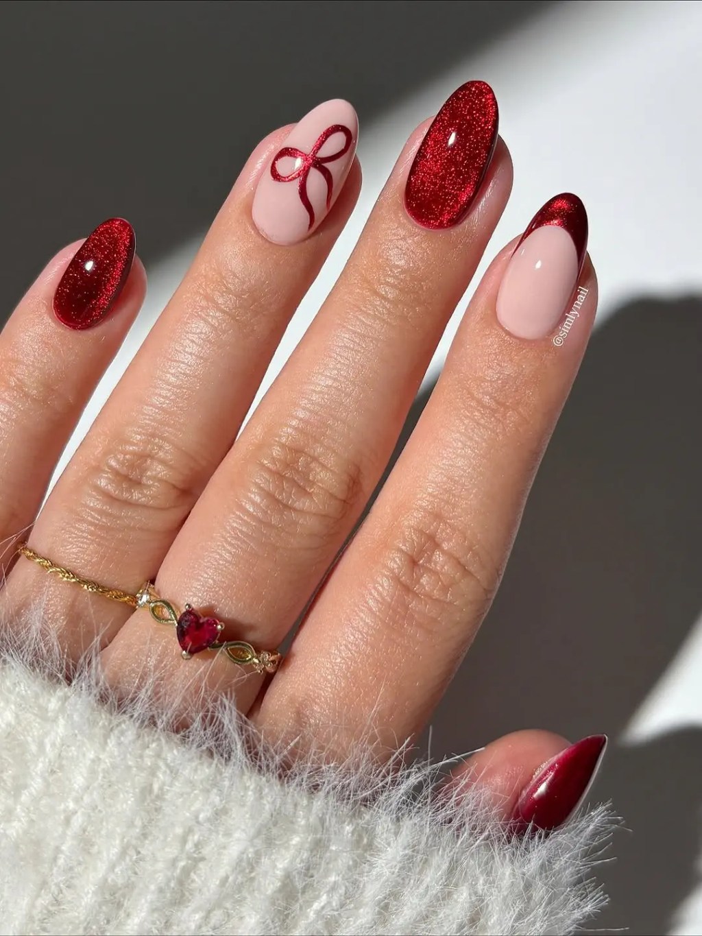 Festive Red Glitter French with Bow Festive Red Glitter French with Bow — Winter Nail Colors for Women Over 40