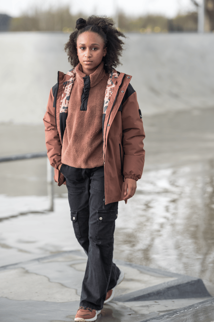 Brown Fleece Layered Under Brown Parka with Black Pants — Winter Outfits for Black Girls