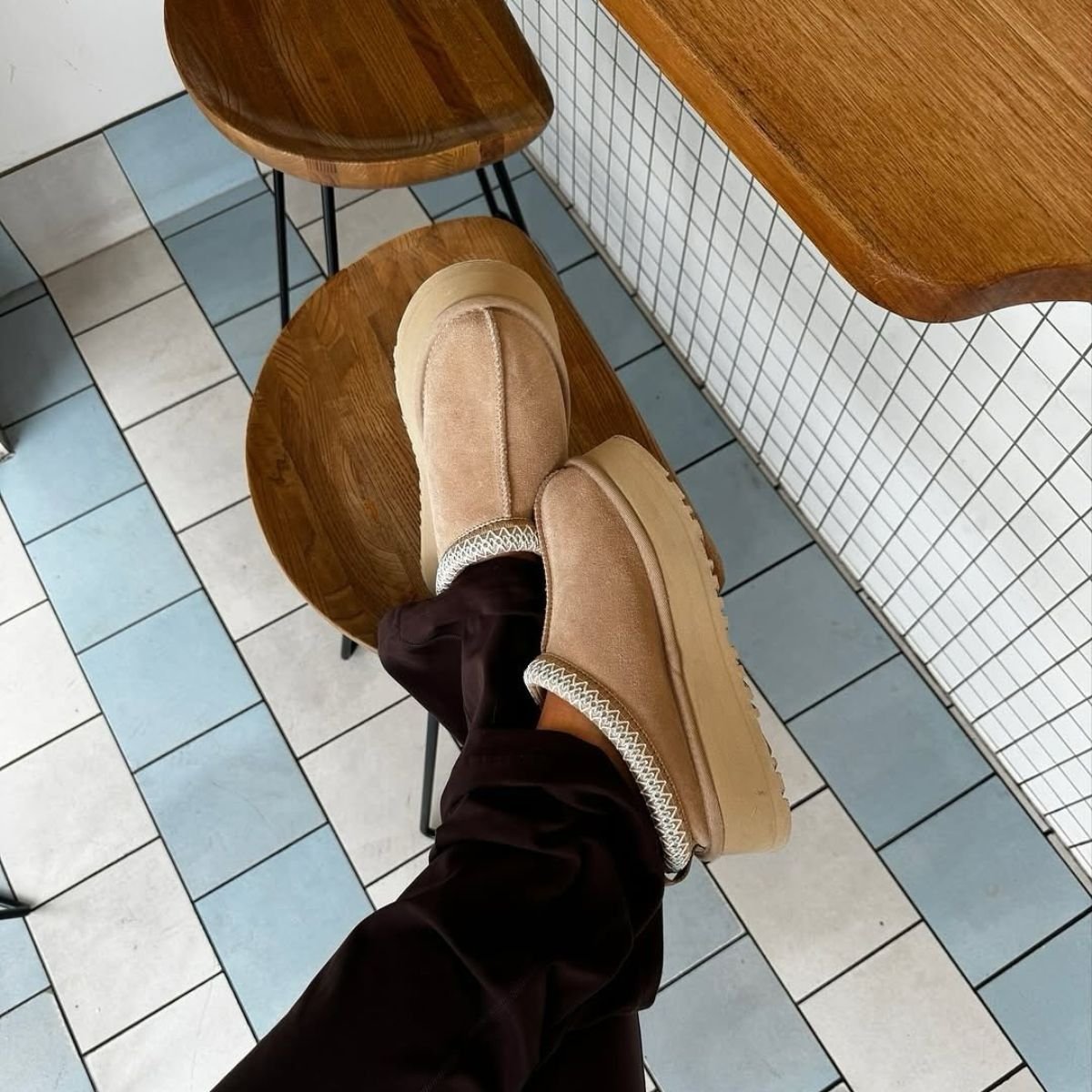 Ugg Slippers with Patterned Trim and Dark Trousers — Ugg Slippers Outfits