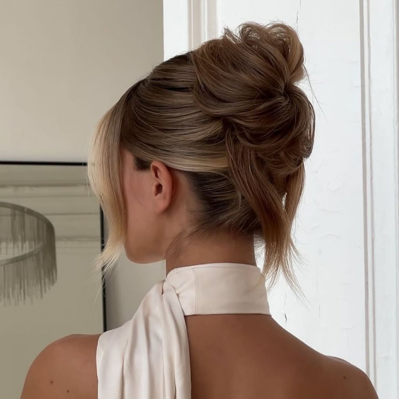 Voluminous Messy Light Brown Bun — Winter Formal Hairstyles