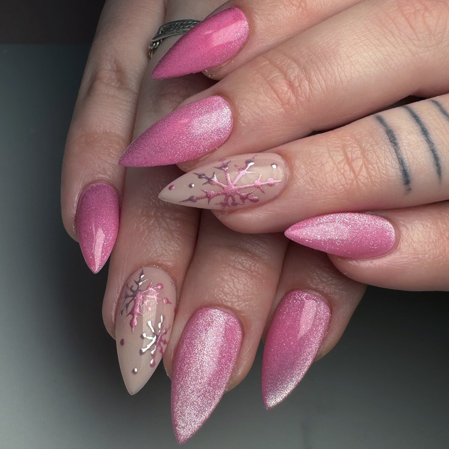 Snowflakes And Metallic Pink Accents Visual Idea — Winter Stiletto Nails