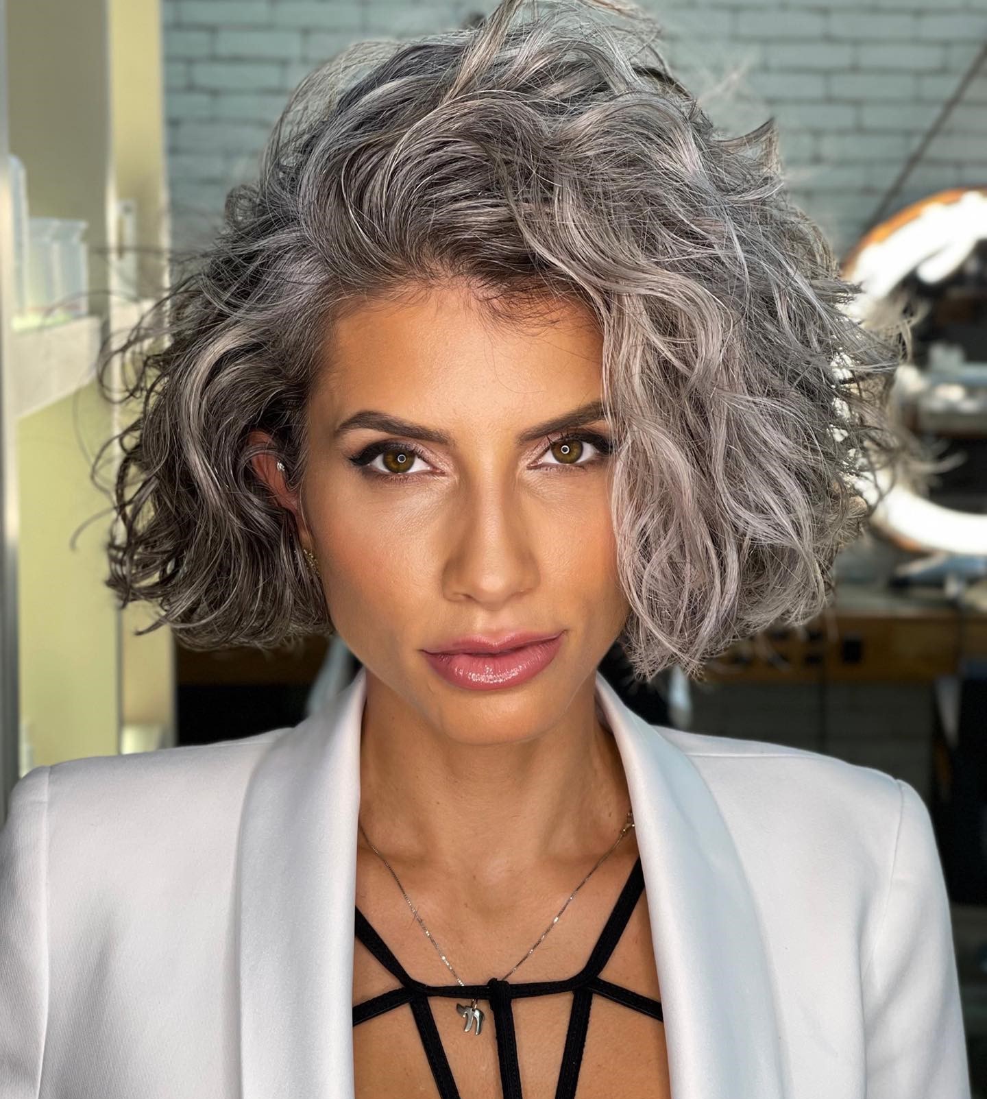 Voluminous Curly Shag With Choppy Bangs Voluminous Curly Shag With Choppy Bangs — Winter Haircuts for Gray Hair
