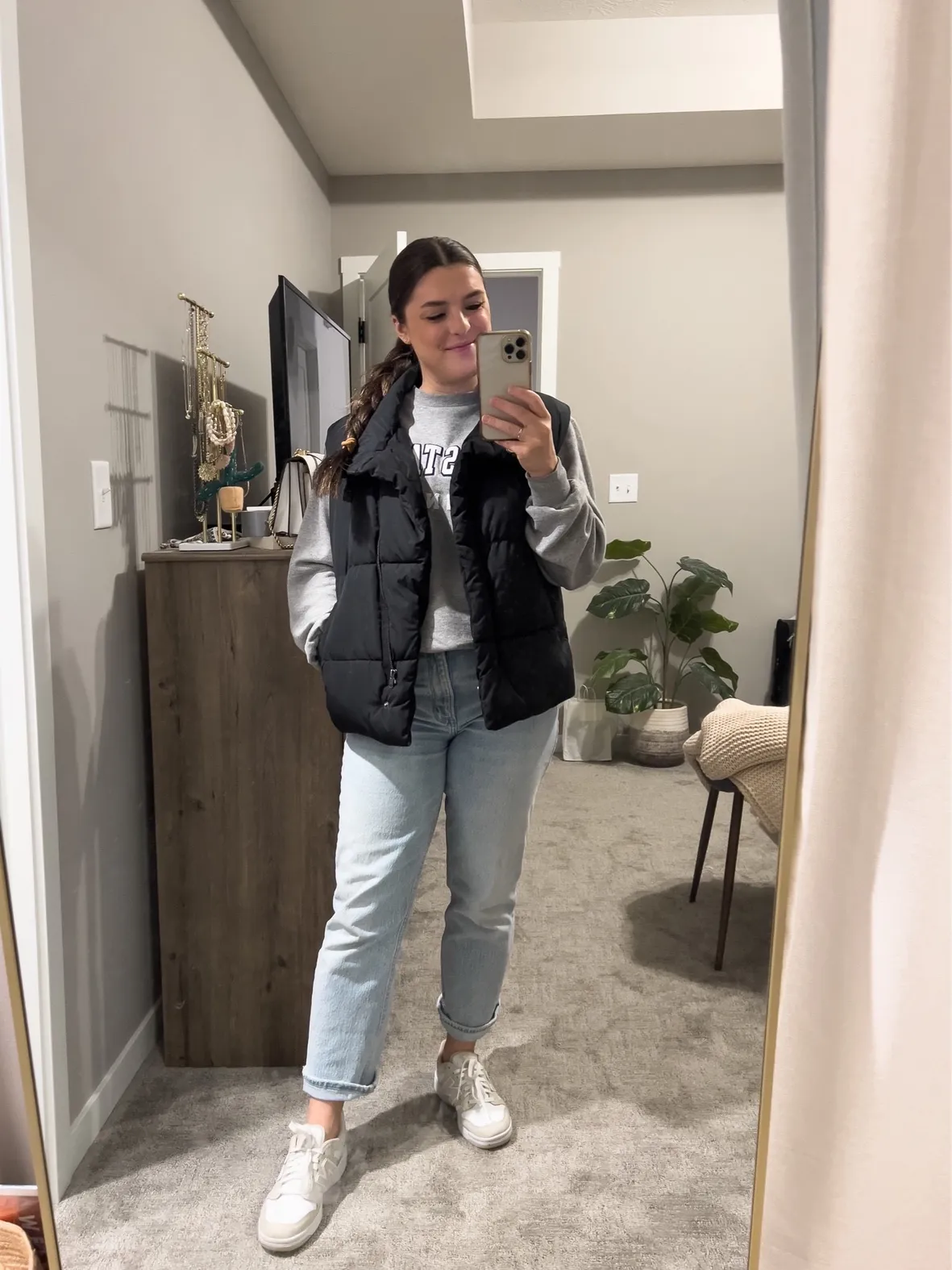 Black Puffer Vest Layered Over Grey Sweatshirt — Winter Teacher Outfits