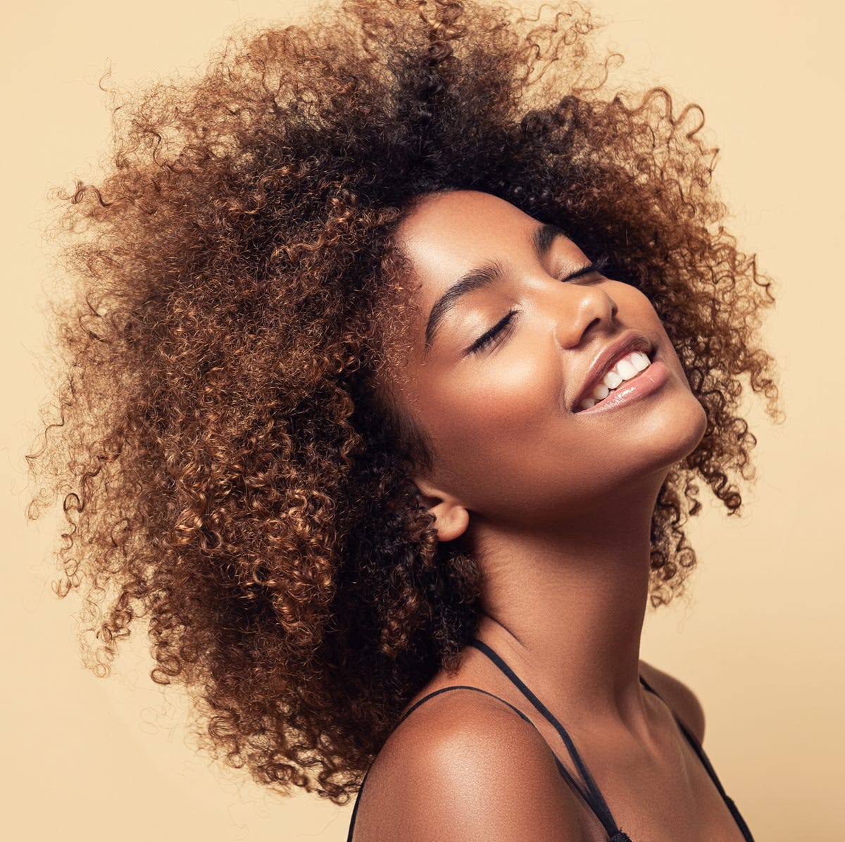 Mid-Back Curls With Caramel Highlights Mid-Back Curls With Caramel Highlights — Winter Haircuts for Curly Hair