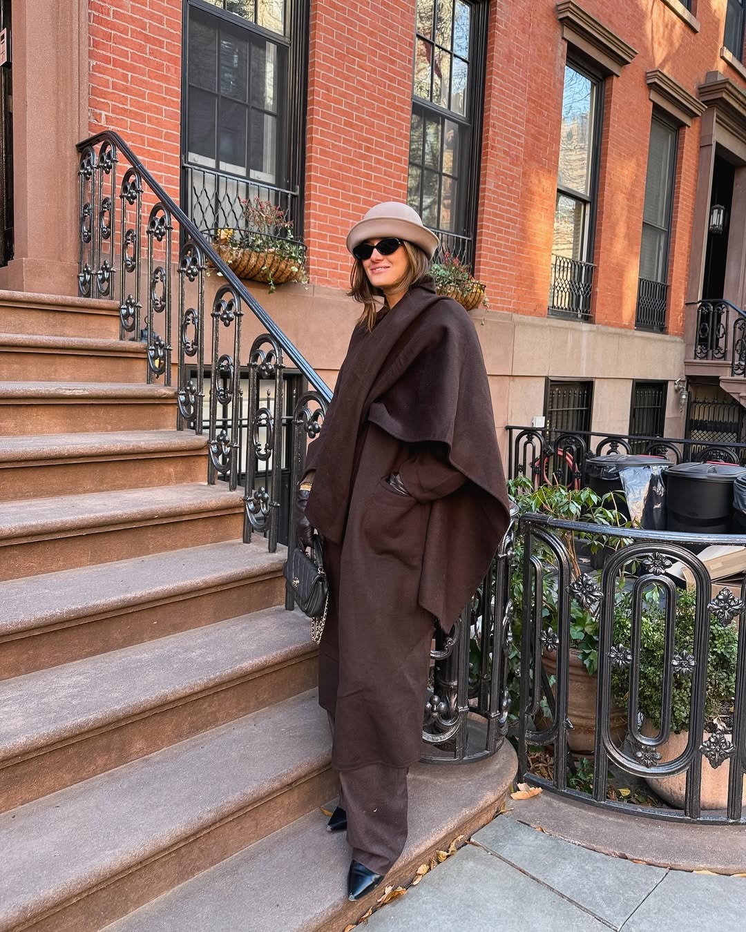 Monochromatic Brown Ensemble Featuring an Oversized Poncho and Wide-Leg Pants Monochromatic Brown Ensemble Featuring an Oversized Poncho and Wide-Leg Pants — NYC Winter Outfits
