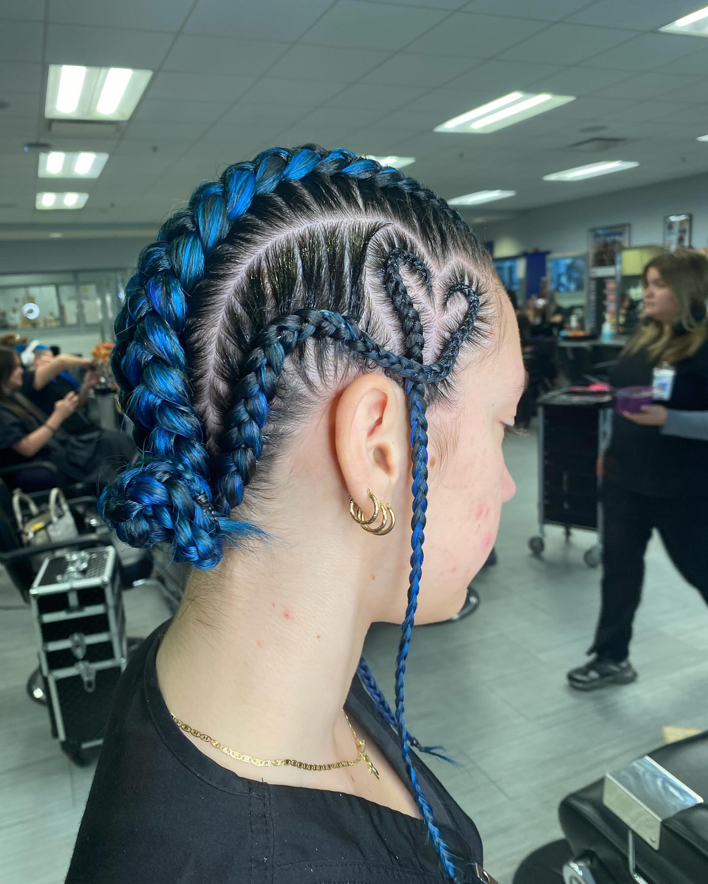 Braided Updo With Blue and Black Strands Braided Updo With Blue and Black Strands — Winter Haircuts for Heart Shaped Faces
