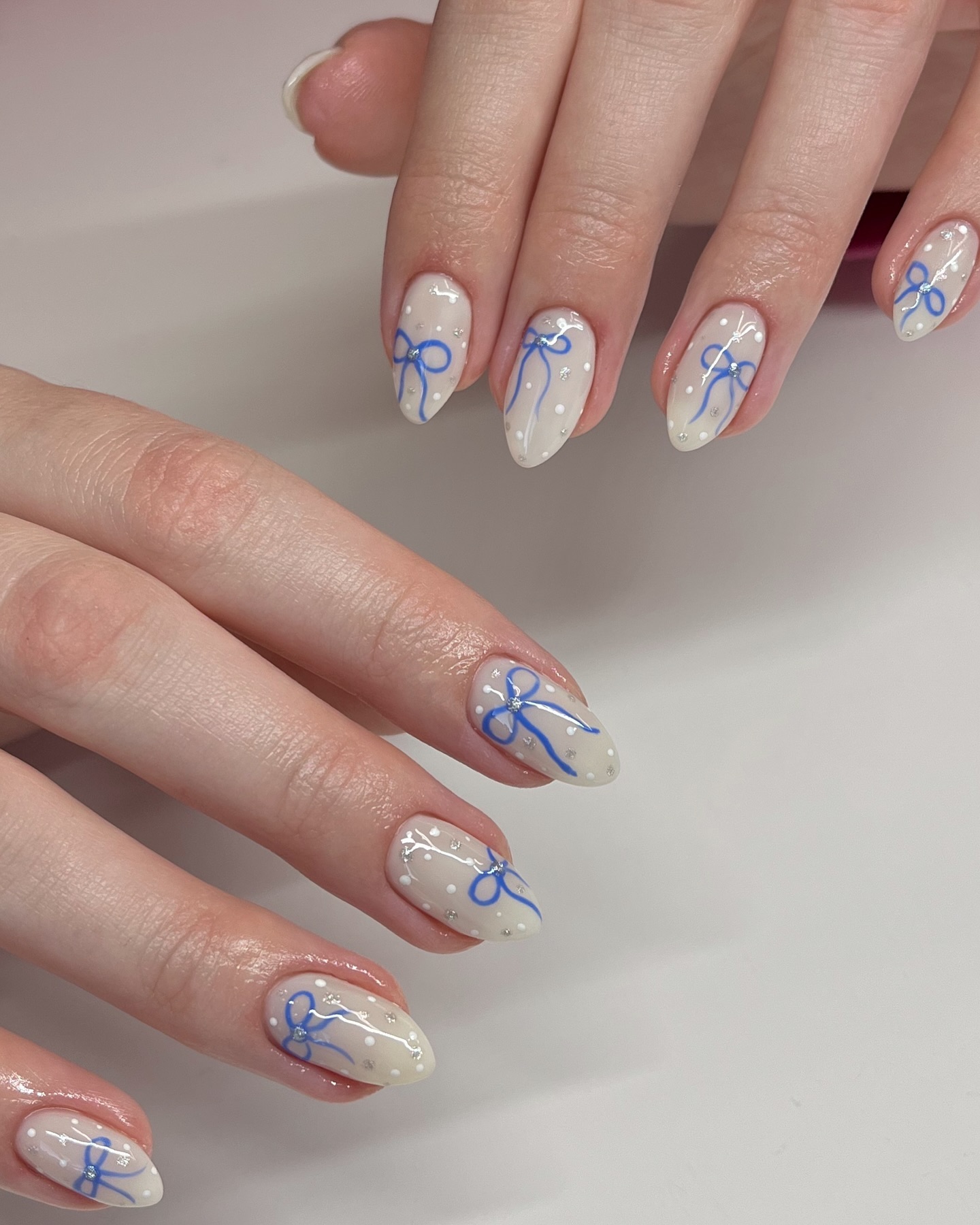 Delicate Blue Bows on Off-White Base — Winter Blue Nails