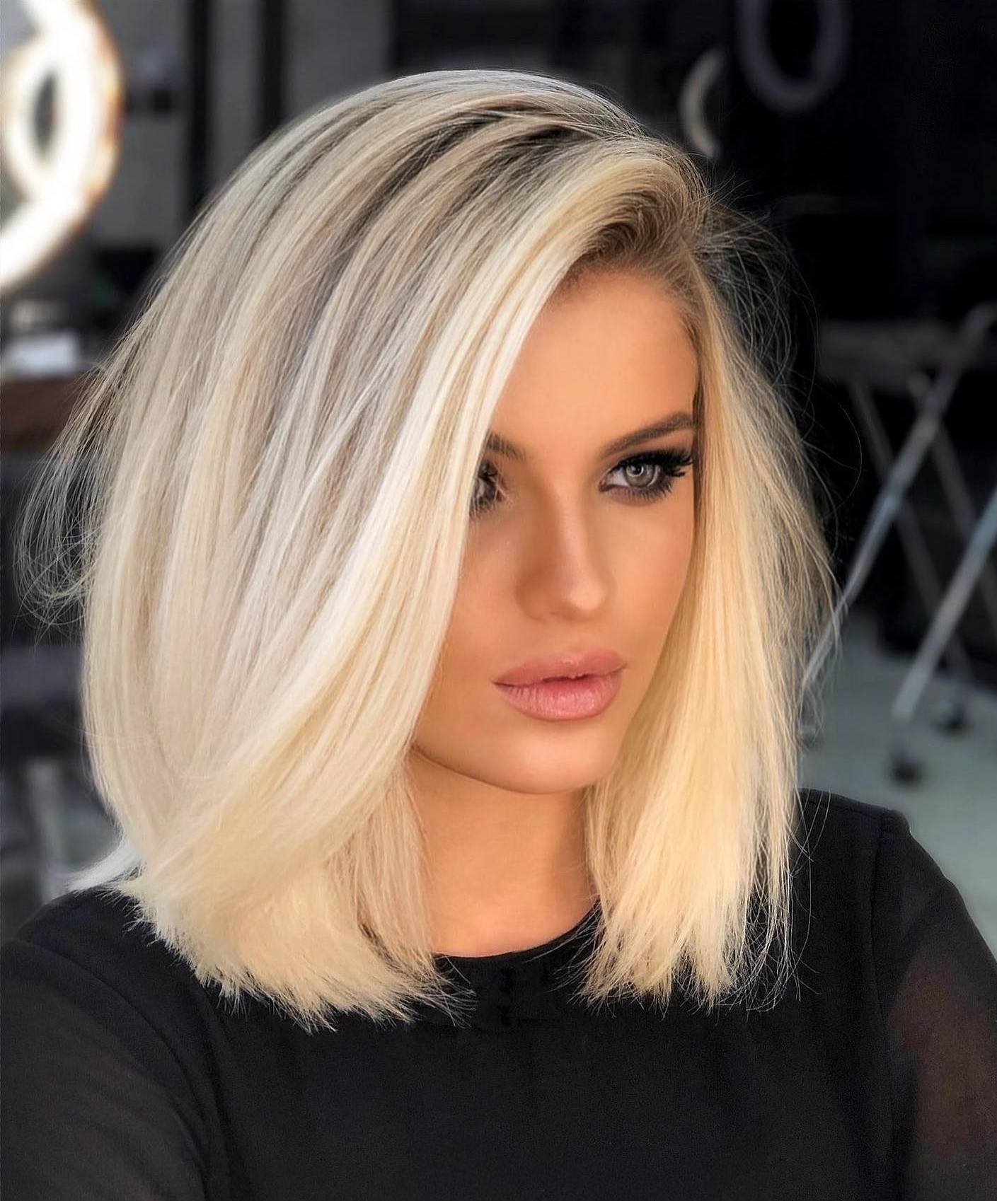 Collarbone-Length Platinum Blonde Angled Bob Collarbone-Length Platinum Blonde Angled Bob — Winter Haircuts for Straight Hair