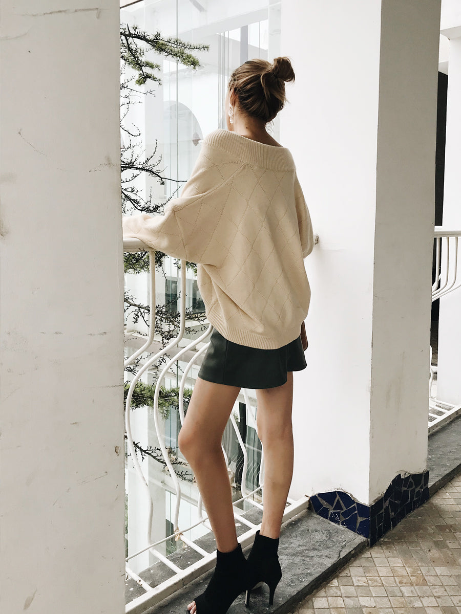 Off-the-Shoulder Detail: Cream Sweater with Mini Skirt Off-the-Shoulder Detail: Cream Sweater with Mini Skirt — Oversized Sweater Outfits