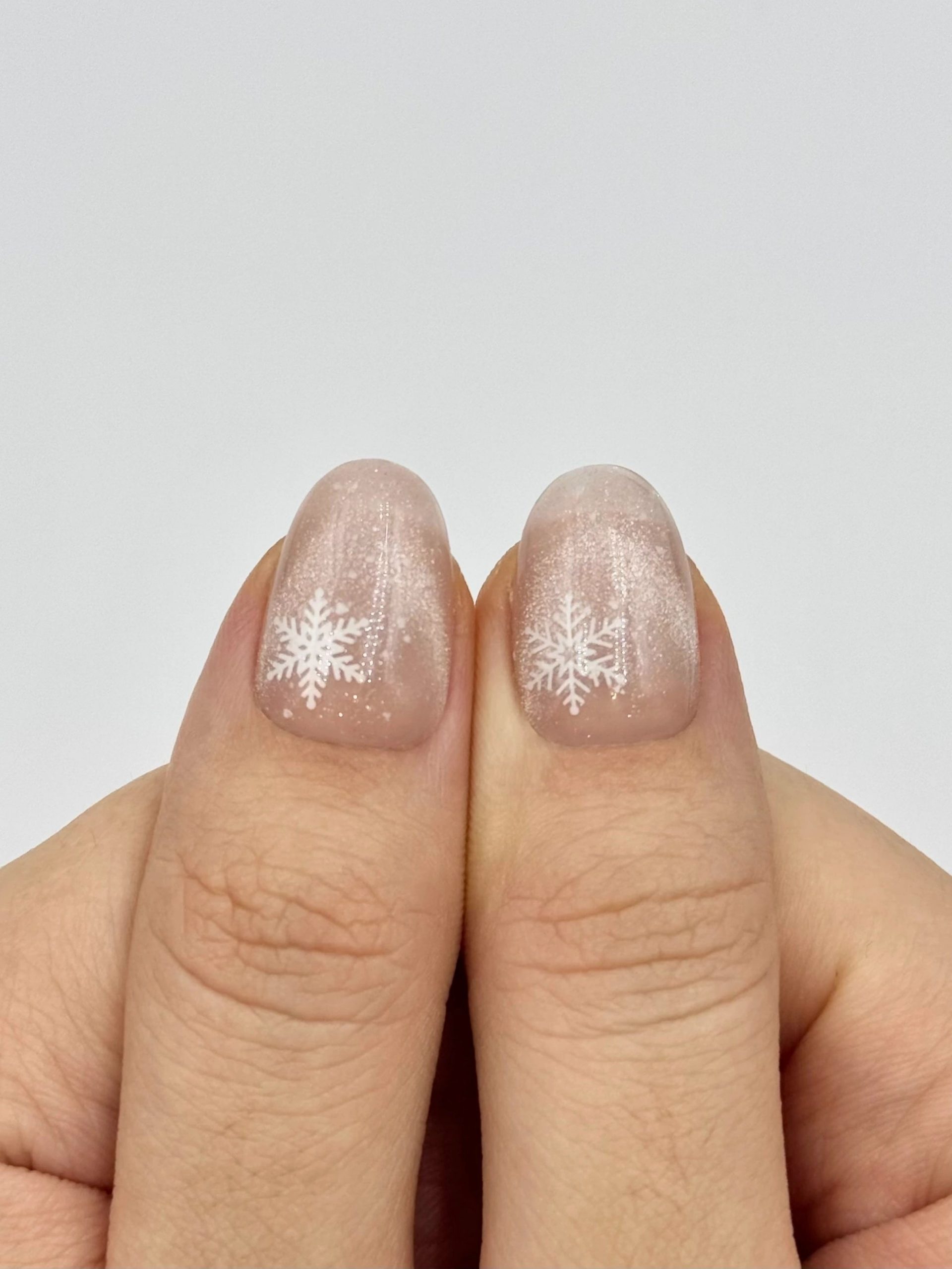 Sheer Nude Snowflake Decal Short Oval Nails Sheer Nude Snowflake Decal Short Oval Nails — Natural Winter Nails