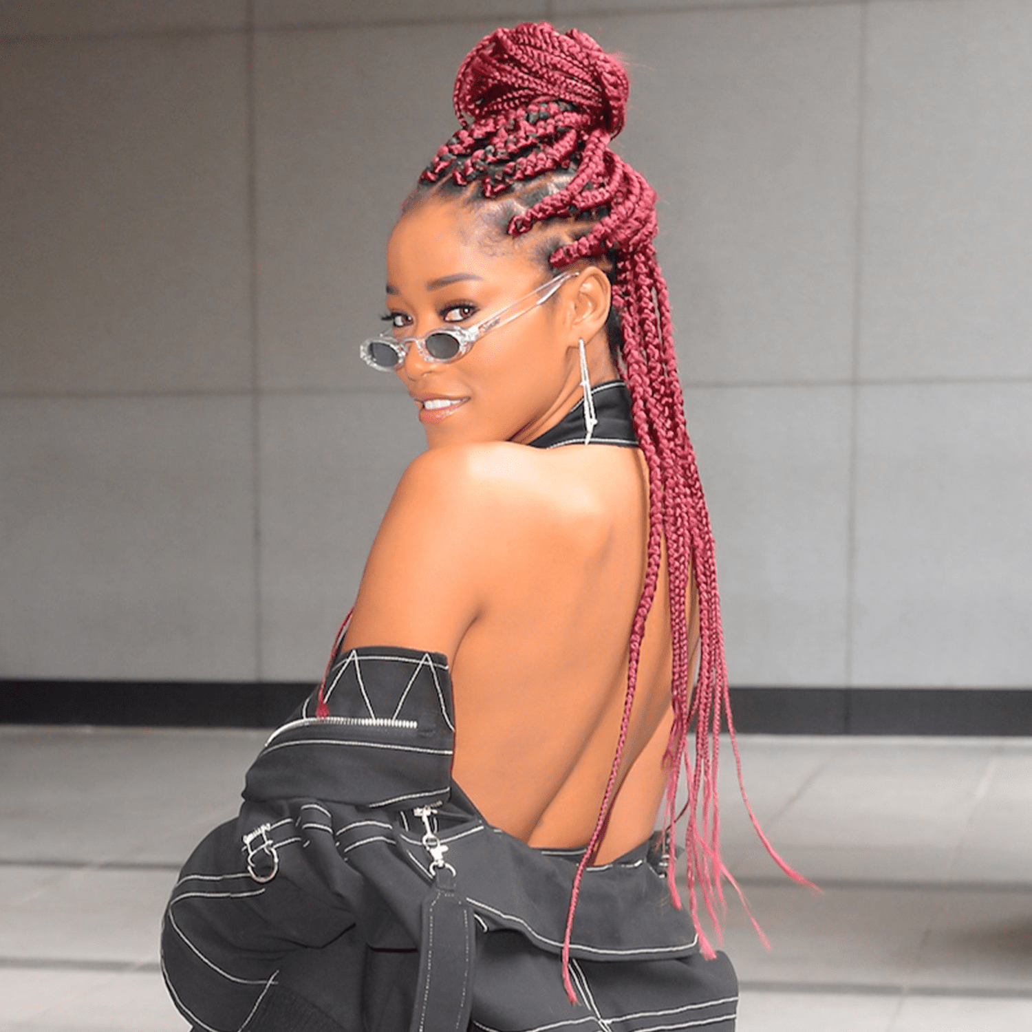 Vibrant Red Braids in a High Bun — Winter Braid Colors for Black Women