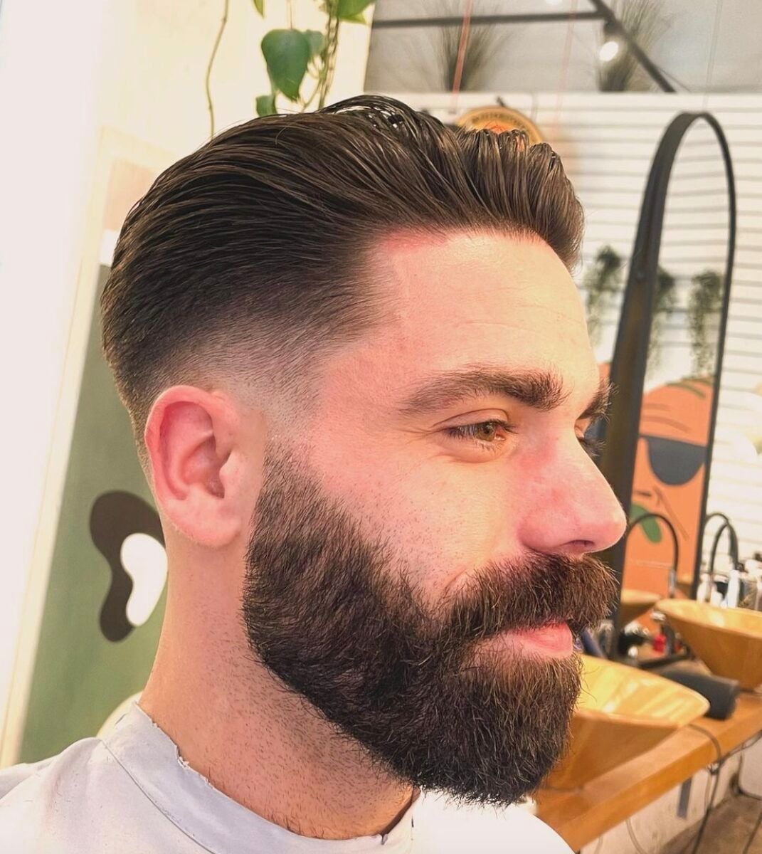 Slicked Back With Sharp Fade — Winter Hairstyles for Men