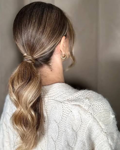 Polished Ponytail With Gentle Waves — Winter Date Night Hairstyles