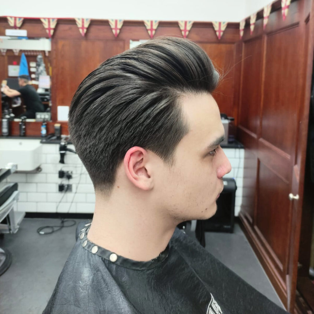Ear Voluminous Pompadour With Middle Part — Winter Hairstyles for Men