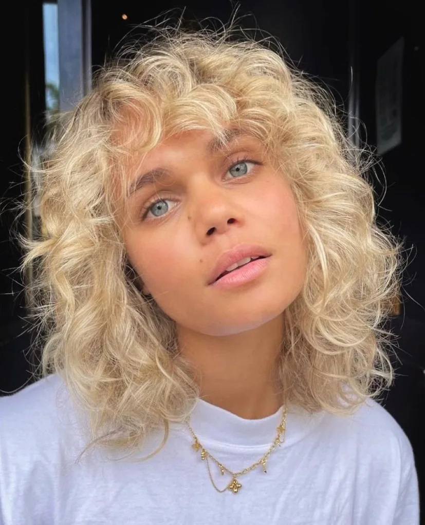 Ash Blonde Shag With Full Curly Bangs Ash Blonde Shag With Full Curly Bangs — Winter Haircuts for Curly Hair
