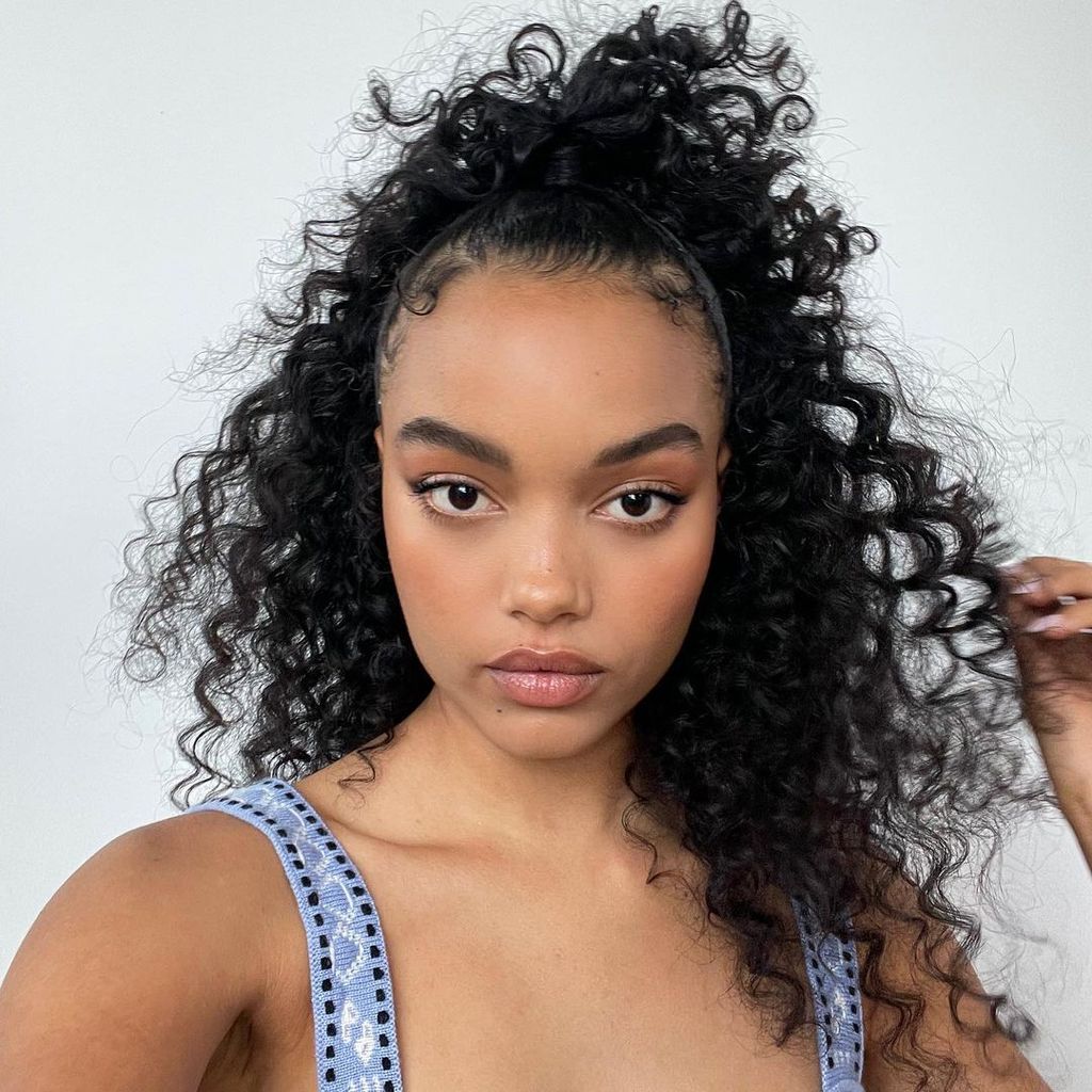 High Ponytail With Face-Framing Tendrils High Ponytail With Face-Framing Tendrils — Winter Hairstyles for Curly Hair